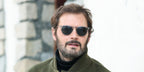French actor Hugo Becker was seen wearing transparent grey David Beckham DB 1160/S KB7KU sunglasses with blue lenses at the Les Arcs Film Festival 2025.