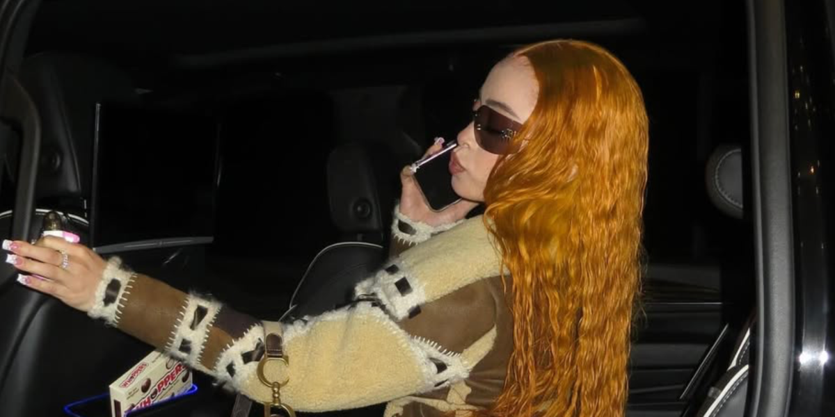 Ice Spice was seen wearing gold Miu Miu Rimless Runway MU 54YS 5AK06I sunglasses with purple brown lenses in her Instagram post