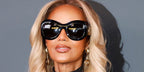 Supermodel Iman was seen wearing black Gucci GG2275S 001 round sunglasses at the Gucci Cruise 2027 fashion show in Times Square, New York City.