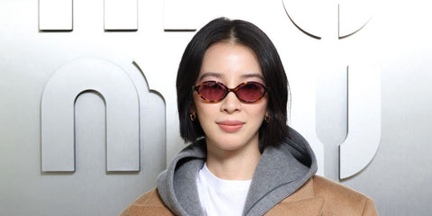 Irene Kim, widely known as Ireneisgood, was seen wearing brown tortoiseshell Miu Miu MU 04ZS VAU50D oval sunglasses with purple bordeaux lenses at the Miu Miu Spring/Summer 2024 fashion show during Paris Fashion Week. Shop online now on Pretavoir