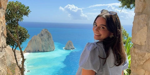 Travel content creator Isabella Fiori was seen wearing tortoiseshell Miu Miu MU 07YS 14L09Z sunglasses with green lenses in Greece, shared on her Instagram in September 2024. Shop online now on Pretavoir