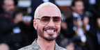 J Balvin was seen wearing gold Miu Miu MU A56S 5AK90L sunglasses with brown gradient lenses on the Opening Day of 83rd Venice Film Festival, September 2026