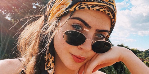 Brazilian media personality Jade Picon was seen wearing gold Ray-Ban Oval RB 3547 001/31 sunglasses.