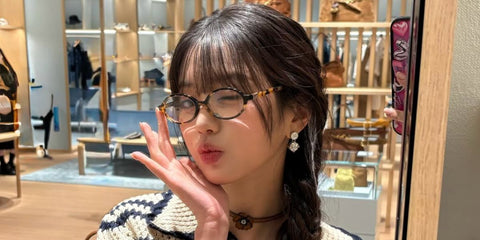 South Korean singer Jang Won-young of the girl group IVE was seen wearing honey havana Miu Miu MU 01XV VAU1O1 oval optical glasses at a Miu Miu store event in June 2025. Shop online now on Pretavoir