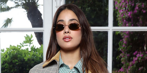 Bollywood actress Janhvi Kapoor was seen wearing silver Miu Miu MU A54S 1BC90Q rimless oval sunglasses with brown lenses at the "Grande Envie" Miu Miu Lunch in Antibes, France, May 2025. Shop online now on Pretavoir