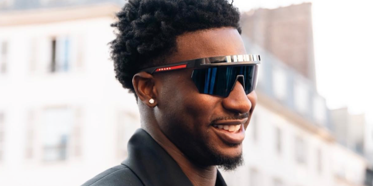 Basketball player Jaren Jackson Jr. was seen wearing black Prada Linea Rossa SPS 01Y 1BO06F sunglasses during Paris Men's Fashion Week season Spring/Summer 2024.
