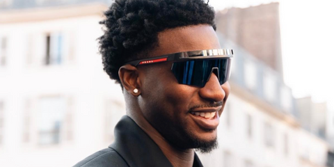 Basketball player Jaren Jackson Jr. was seen wearing black Prada Linea Rossa SPS 01Y 1BO06F sunglasses during Paris Men's Fashion Week season Spring/Summer 2024.
