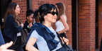 Jenna Ortega is wearing Bottega Veneta BV1189S 001 Black Cat Eye Sunglasses at a press junket for 'Beetlejuice Beetlejuice' 