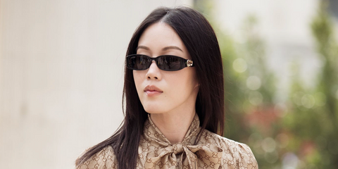 Content creator Jenny Tsang was seen wearing black Gucci GG1661S 001 sunglasses at the Gucci Fall/Winter 2026 fashion show during Milan Fashion Week.
