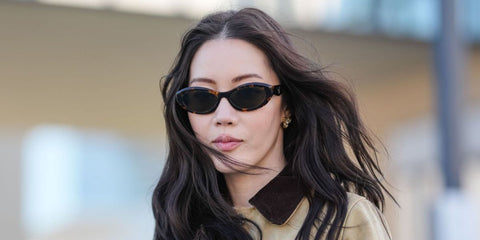 Influencer and designer Jenny Tsang was seen wearing tortoiseshell Prada PR 26ZS 14L09Z sunglasses at the Prada Fall/Winter 2025 fashion show during Milan Fashion Week.
