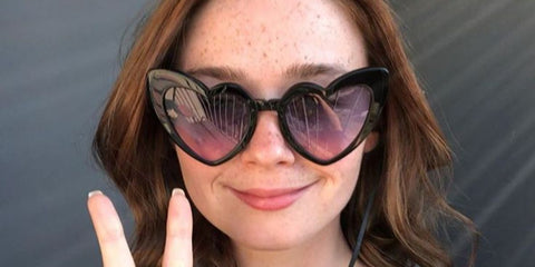 Jessica Barden was seen wearing black Saint Laurent Sun SL 181 LouLou 001 heart-shaped sunglasses
