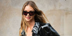 Jessie Andrews was seen wearing black Givenchy GV40051I 01A wraparound sunglasses with grey lenses to attend the Givenchy Spring/Summer 2024 fashion show during Paris Fashion Week