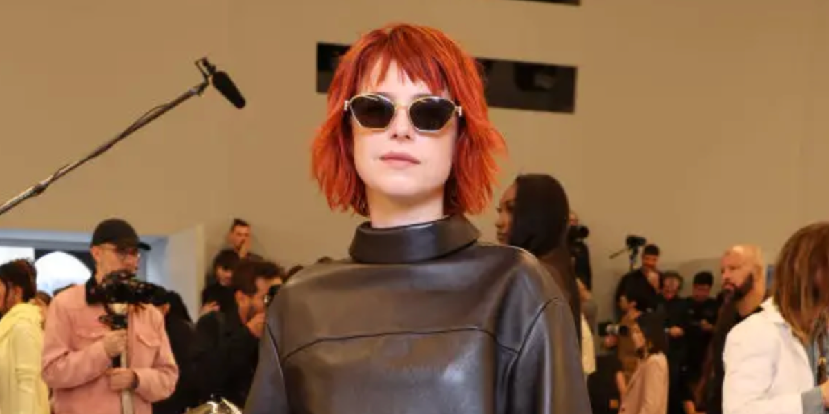 Irish actress Jessie Buckley was seen wearing shiny gold Loewe Metal LW40115U 30A cat eye sunglasses to attend the Loewe Spring/Summer 2024 fashion show during Paris Fashion Week
