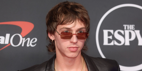 Basketball player Jimmy Sotos was seen wearing gold Ray-Ban x ASAP Rocky Metal RB 3928 001/7I sunglasses with brown mirror lenses at the ESPY Awards 2026.