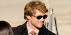 Joe Alwyn wore Valentino VG0047S 001 rectangular sunglasses at the Valentino Spring Summer 2027 show during Paris Fashion Week.