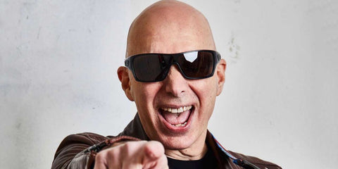 American guitarist Joe Satriani was seen wearing polished black Oakley Gascan OO9014 03-471 sunglasses with grey lenses.