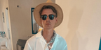 Joe Sugg was seen wearing the iconic Ray-Ban Clubmaster 3016 W0365 Black half-rim sunglasses in his Instagram post