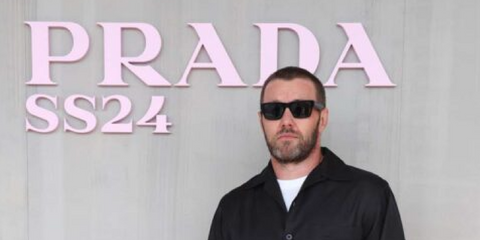 Joel Edgerton wears Prada PR 19WS 1AB5S0 sunglasses at the Prada Spring/Summer 2024 fashion show in Milan