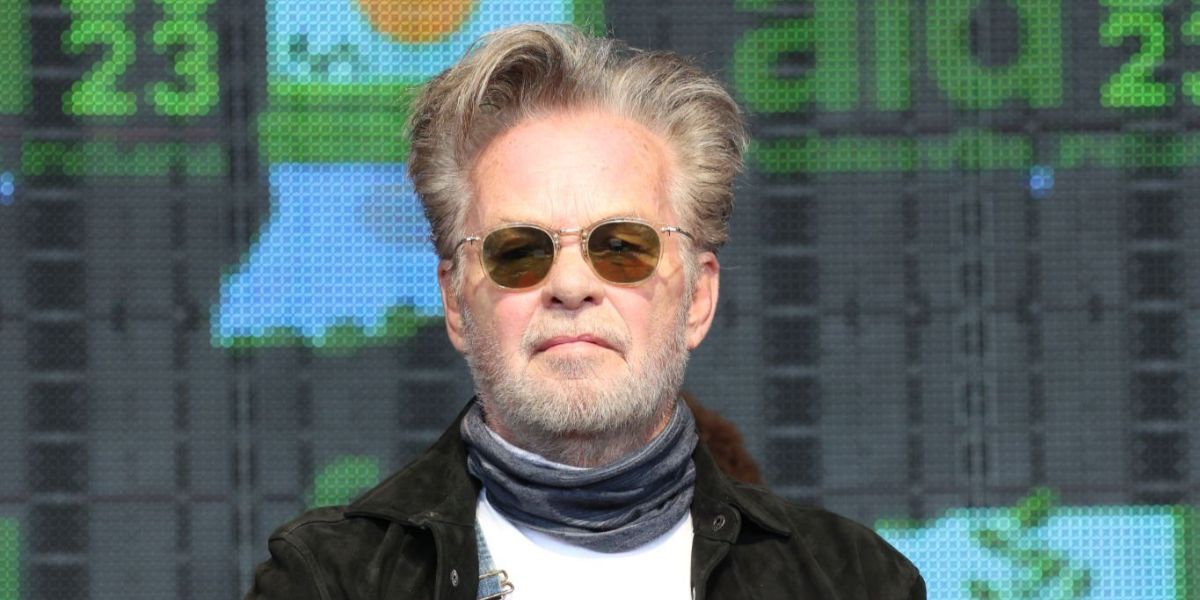 Celebrity singer-songwriter John Mellencamp was seen wearing transparent yellow Oliver Peoples OP-506 OV5350S 1094/52 sunglasses with green lenses at the Farm Aid 2023 in Noblesville, Indiana.