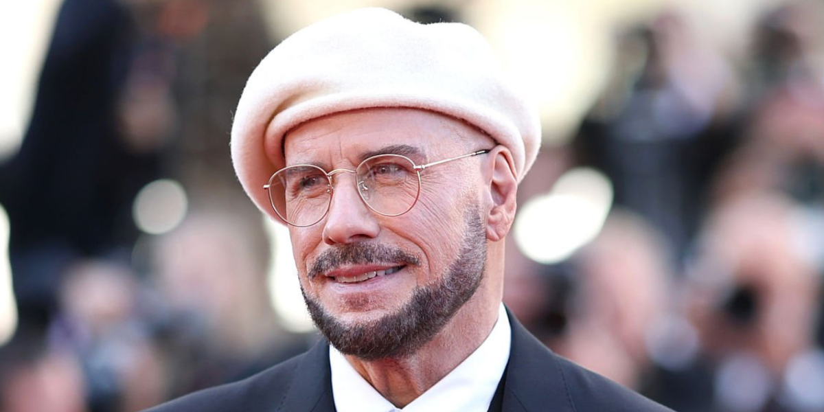 Actor John Travolta was seen wearing gold Ray-Ban Round Metal RB 3447V 2500 optical glasses at the Cannes film Festival 2026.