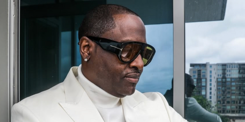 Singer-songwriter Johnny Gill was seen wearing black Tom Ford Bronson TF1044 01E sunglasses with yellow lenses in his Instagram post, June 2024.