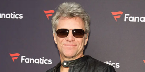 Jon Bon Jovi is seen wearing Prada Linea Rossa SPS 50Z 5AV02P sunglasses with gunmetal frame and brown gradient lenses to attend the Fanatic's Big Game Weekend Event in San Francisco