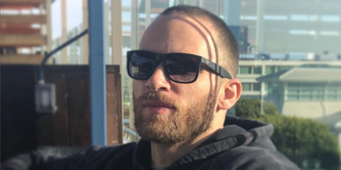 Actor Jonah Wharton was seen wearing rubber black Ray-Ban Justin 4165 601/8G sunglasses with grey gradient lenses in his Instagram post, March 2018.