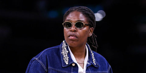Bosnian-Bahamian basketball player Jonquel Jones was seen wearing Prada PR 65ZS ZVN09T oval sunglasses ahead of the New York Liberty game against the Phoenix Mercury in Arizona, June 2025. Shop online now on Pretavoir
