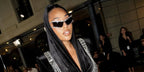 Jordyn Woods was seen wearing crystal studded Swarovski SK7022 4001/87 shield sunglasses to attend the Yanina Couture Fall/Winter 2024 fashion show during Paris Haute Couture Week