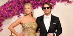 Josh Hartnett, pictured with wife Tamsin Egerton, was seen wearing black Oliver Peoples Gregory Peck Sun OV5217S 1031/P2 round sunglasses with grey Polarised lenses at the 96th Annual Academy Awards in Los Angeles