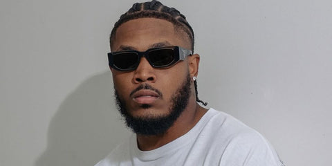American football player Josh Jacobs of the Green Bay Packers was seen wearing transparent grey Prada PR 09ZS 18S09T sunglasses in his Instagram post, June 2025.