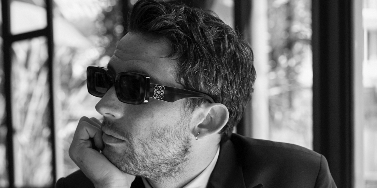 Josh O'Connor was seen wearing tortoiseshell Loewe Anagram LW40101I 52E sunglasses, photographed by Julian Ungano