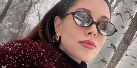 Influencer and creator Jourdan Sloane was seen wearing tortoiseshell Miu Miu MU 04ZS VAU07F oval sunglasses with grey lenses in her Instagram reel, December 2025.
