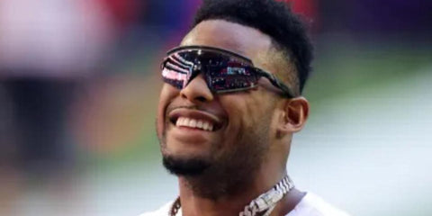 American football wide receiver JuJu Smith-Schuster was seen wearing black Oakley Encoder OO9471 03 Prizm in his Facebook post