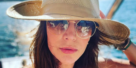 Actress Julie Benz was seen wearing gold Ray-Ban Jack RB 3565 001/51 sunglasses with brown gradient lenses in her Instagram post, December 2022.