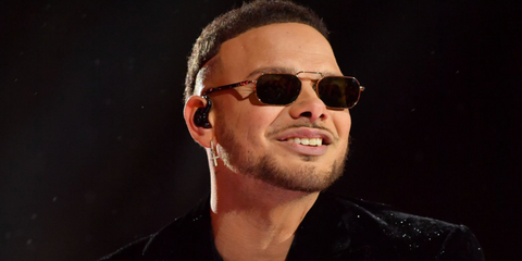 American country singer Kane Brown was seen wearing gold Persol 1020S 515/31 rectangular sunglasses onstage at Bicentennial Capitol Mall State Park in Nashville, Tennessee, December 2024.