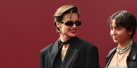 Polish-Italian actress Kasia Smutniak, pictured with daughter Sophie Taricone, was seen wearing black Gucci GG1661S 001 sunglasses at the Gucci Spring/Summer 2025 fashion show during Milan Fashion Week. Shop online now on Pretavoir