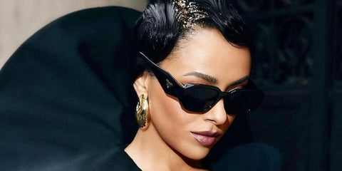 Kat Graham was seen wearing black Prada PR 17WS 1AB5S0 Symbole Sunglasses to attend the Stéphane Rolland Haute Couture Spring/Summer 2024 fashion show during Paris Couture Week