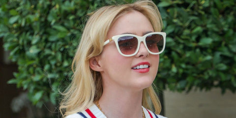 Kathryn Newton was seen wearing white cream Polo Ralph Lauren PH4201U 6057/13 sunglasses with brown gradient lenses in Paris, August 2024