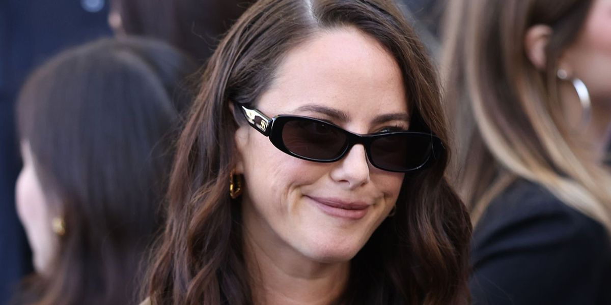 Kaya Scodelario wore black Balenciaga BB0510S 001 Nova Rectangle sunglasses at the Balenciaga Spring Summer 2027 show during Paris Fashion Week.