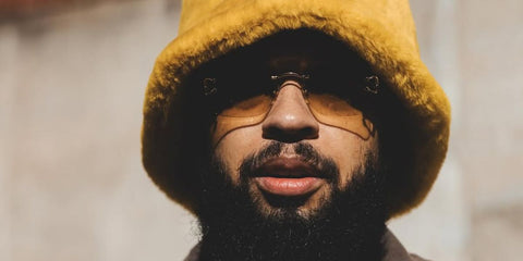 Musician Kenneth Whalum was seen wearing Cartier C Decor CT0330S 003 rimless sunglasses with yellow gradient lenses in his Instagram post