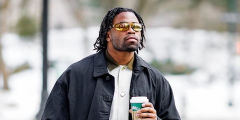 American football player Kenny Moore II of Indianapolis Colts was seen wearing metal rust Miu Miu MU A02S 16Y8G1 sunglasses with gold mirrored lenses in New York City, February 2026.