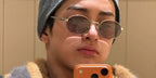 South Korean singer Keonho of boy band Cortis was seen wearing pecan Prada PR B56S 24E20I oval round sunglasses in a social media post