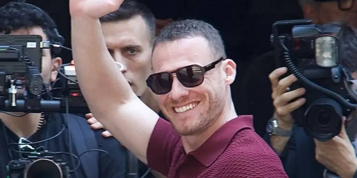 Turkish-American actor Kerem Bursin was seen wearing black and gold Dolce&Gabbana DG4464 501/87 sunglasses at the Dolce & Gabbana Menswear Spring/Summer 2026 fashion show during Milan Men's Fashion Week