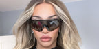 Drag performer Kerri Colby was seen wearing Oakley Encoder OO9471 03 Prizm sunglasses in her Instagram post, December 2024.
