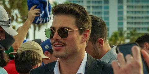 Swiss professional ice hockey player Kevin Fiala was seen wearing Ray-Ban RB 3548N 001 Hexagonal Gold With Flat Lenses at the NHL All Stars skills competition 2023.