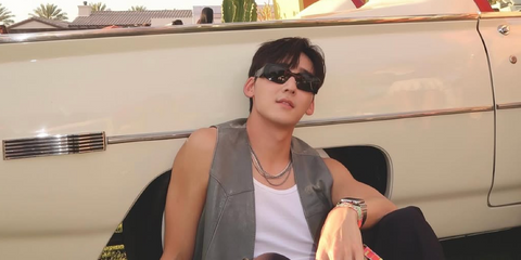 Kevin Woo was seen wearing tortoiseshell Prada PR 17WS 2AU8C1 Symbole sunglasses with brown lenses at the 818 Outpost during Coachella Music Festival 2025.