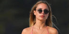 Entrepreneur and television personality Kimberley Garner was seen wearing black Ray-Ban Round Metal RB 3447N 002/71 sunglasses with grey gradient lenses in her Facebook post, May 2025.