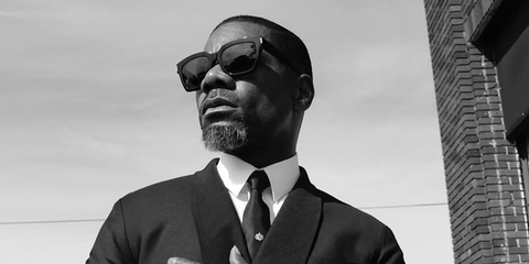 Gospel singer Kirk Franklin was seen wearing black Saint Laurent Sun Bold 1 002 sunglasses in his Instagram post, May 2024.