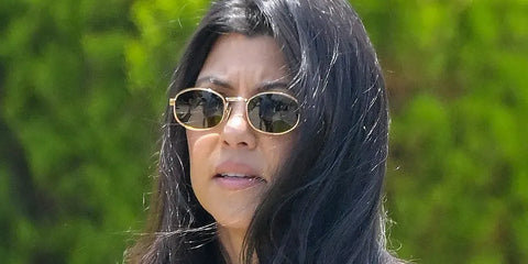 Kourtney Kardashian was seen wearing gold Prada PR B53S 5AK09Z sunglasses in The Kardashians season 7, episode 8.